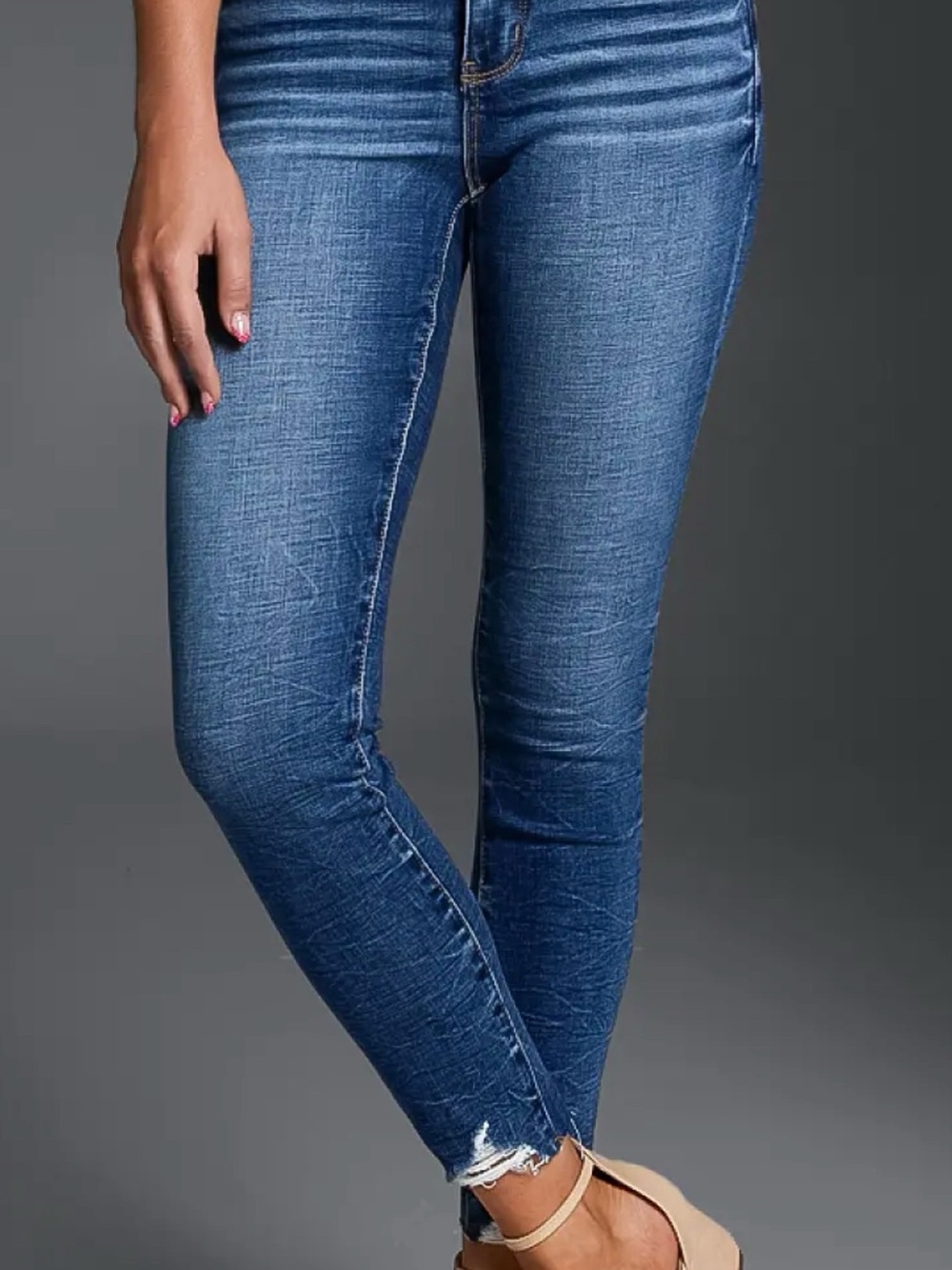 Buckle fit 53 Medium Blue Skinny Jeans with Distressed Hem